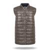 Reversible, two-sided vest with marron and black colours. Stud fastening, two front pocekts with zippers