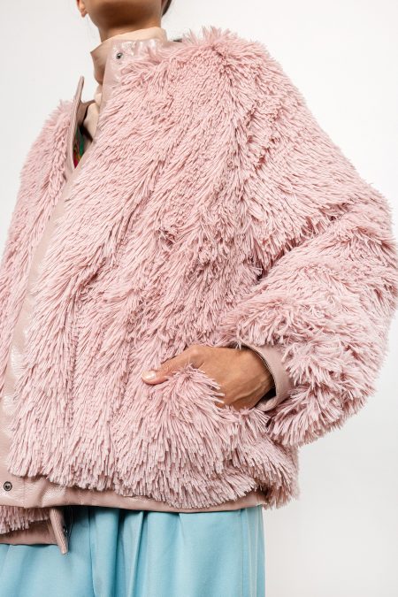 Jacket made with tassels; snap fastening, slightly overiszed cut. Light pink jacket with natural down insulation.