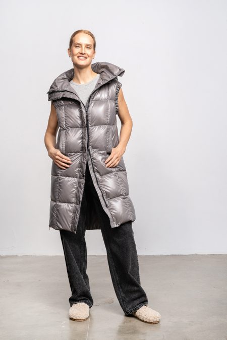 Long vest with zipper and hood; natural goose down insulation. Women vest for spring and autumn.