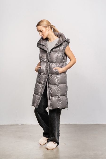 Long vest with zipper and hood; natural goose down insulation. Women vest for spring and autumn.