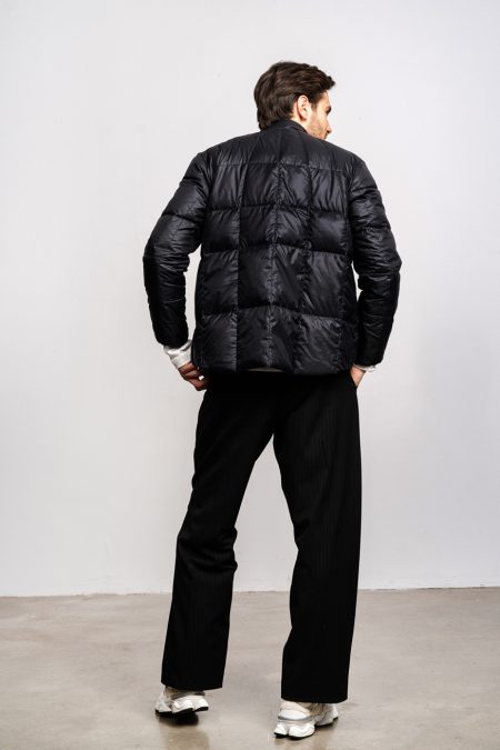 Man light jacket for spring and fall, wirth natural down filling. Zipper and front pockets. Compact jacket.