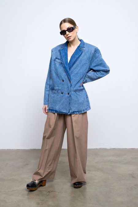 Denim blazer from spring 2023 collection. Log sleeved, oversized blazer made with cotton soft denim. Buttons and front pockets.