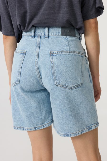 Denim shorts mid-rise with loose leg; front and back pockets, light-blue washed denim.